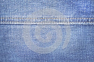 Close up blue denim texture with double thread sewing patterns , jeans fabric for background