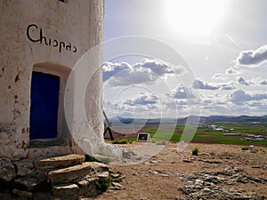 Close up of blue entrance door of Chispas windmill in Consuegra, Castile La Mancha, Spain. photo