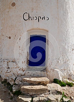 Close up of blue entrance door of Chispas windmill in Consuegra, Castile La Mancha, Spain. photo