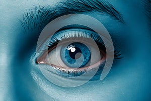 Close up blue eye with future cataract protection scan contact lens, illustrating eye care technology