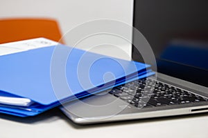 Close Up Blue file folder and Laptop Computer on desk in meeting room, business