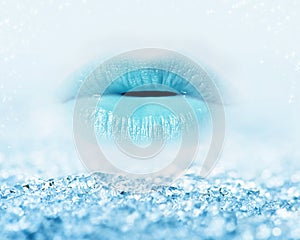 Close-up of blue girl lips with mist and icy snow