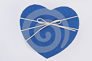 Close up blue heart-shaped gift box.