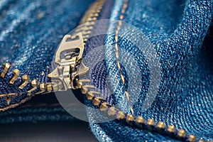 Close up of blue jeans with zipper.