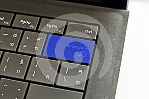 Close up blue keyboard backspace button.