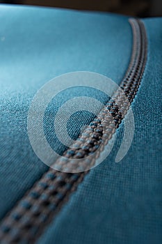 Close up of a blue neoprene surfing wetsuit