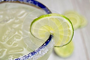 Salted margarita with lime slice