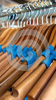 Close-up of blue t-shirts hanging on cloth hanger