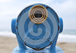 Close up blue telescope view point looking out to sea