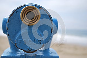 Close up blue telescope view point looking out to sea with copy space to the