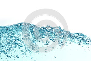 Close up blue water splash with air bubbles. Fresh and clean surface aqua flowing in wave and clean water on white background