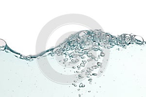 Close up blue water splash with air bubbles on white background isolated. Advertising image with free space for your work