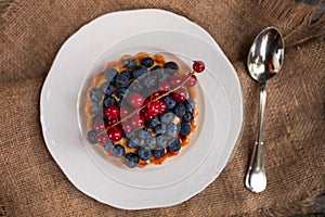 Close-up of blueberry tart on rustic table