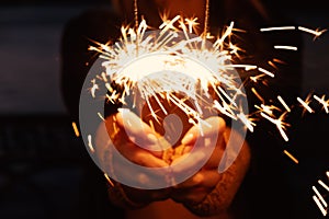Close-up of blurry bruning sparklers in the night photo