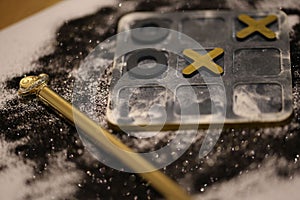 Close-up of a board game with tic tac toe game pieces