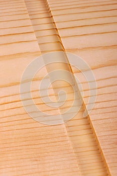 Close-up of a board with a woodworking dado groove vertical