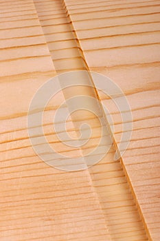 Close-up of a board with a woodworking dado groove vertical photo