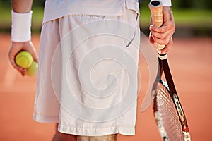 Close up of body part of tennis player photo