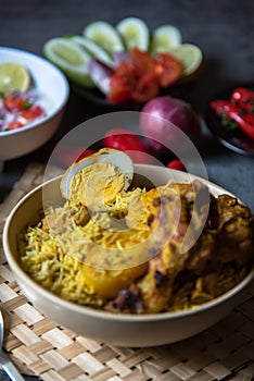 Close up of boiled egg piece on popular food item dum biryani