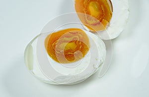 Boiled salty egg half cut on plate