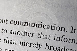 Close-up of a book page showing text related to communication