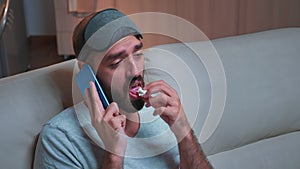 Close up of bored man talking on phone with collegue about social media