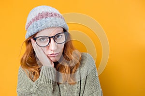 Close up bored young woman looking at camera, isolated on white background