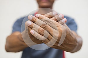 Close-up of both hands of a man numb to his nerve endings