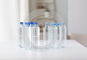 Close up of bottles with drinking water on table