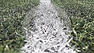 Close-up boundary line on a turf football field