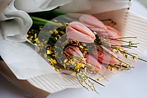 Close-up bouquet of flowers in beige package