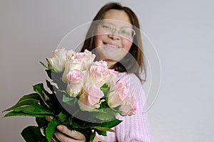 Close-up of bouquet of white, pink roses, in hands of adult woman, brought flowers on date with girlfriend, boyfriend, gives to