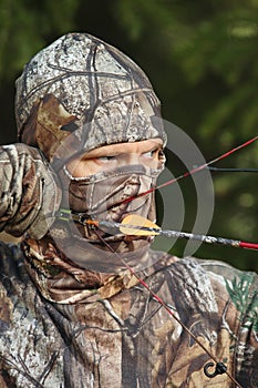 Close-up bow hunter wearing camouflage