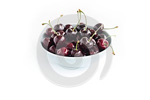 Close-up of a Bowl with Cherries isolated on White Background