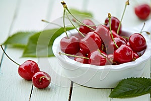 Close up of a bowl of delicious ripe red cherries