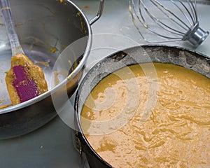 Close-up of a bowl with the raw dough for a carrot cake