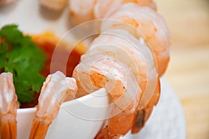 Close-up of a bowl of shrimp with marinara sauce