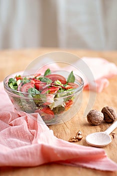 Close-up of a bowl of summer salad on the table.