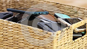 Close up of a box or basket of collected mobile cell phones collected photo