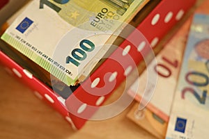 close-up box with family savings, cash 50, 20 euro banknotes on table, concept gift for holiday, payments, savings, banking,