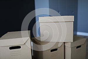 Close-up boxes stand near the front door of room