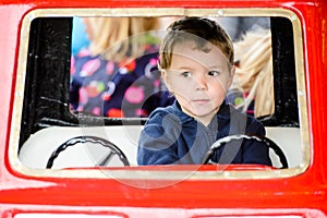 Close Up of a Boy on a Merry-Go-Round Car #2