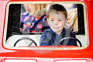 Close Up of a Boy on a Merry-Go-Round Car #3