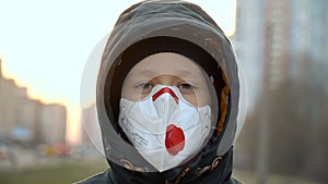 Close-up of a boy wearing a mask at a reception at the doctor