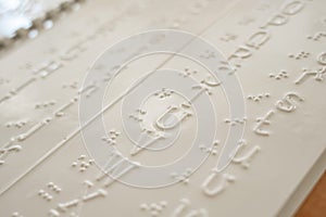 Close-up of a braille decoder with the English alphabet.