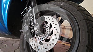 Close-Up: Brake Disc and Wheel on Modern Moped