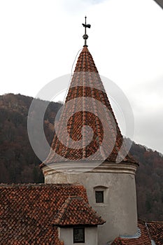 Close-up of Bran Castle Tower, Romania on a Cloudy Day