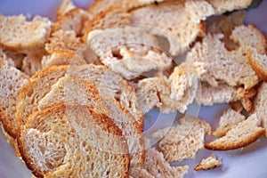 close up of a bread pieces on white background