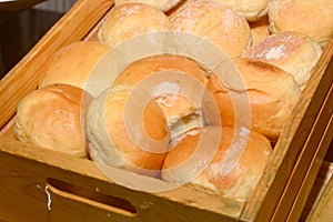Close up bread rolls in mold on wooden box