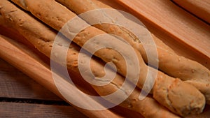 Close Up of Bread Sticks on Cutting Board
